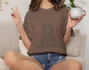 Roofer Cartoon Holding Hammer We Roof at Dawn T-Shirt | Roofing Humor Shirt