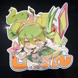 May include: A sticker featuring a cartoon character with green hair and eyes, wearing a green and white outfit. The sticker also includes a green and pink creature and the word "GIN" in orange. The overall design has a cartoonish style.