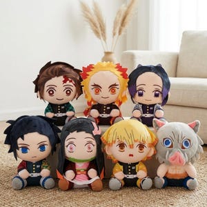 May include: A white ceramic mug with a black handle and the text "But First, Coffee" in a black, handwritten-style font. The mug is on a white surface.