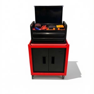 May include: A red and black rolling tool cabinet featuring a top compartment with an open lid, two drawers, and a lower cabinet with two doors. The top tray contains various hand tools including a tape measure and screwdrivers.