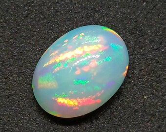 Äthiopischer Opal Cabochon, Multi Feuer Opal Oval Edelstein (9.90x13.17 mm, 3.60 Karat)