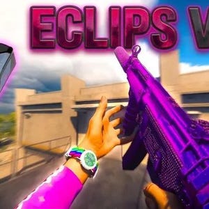 Puede incluir: La imagen presenta un dispositivo electrónico negro con un acento rosa y el texto "ECLIPS V2". Un arma morada se sostiene en el encuadre. Se ve el brazo de una persona, con un reloj colorido.