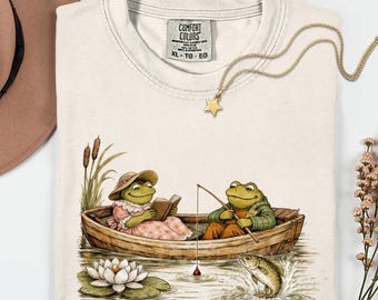 Cottagecore-shirt met kikkers in roeiboot, comfortabele kleuren vintage T-shirt met kikker en pad, esthetisch natuurliefhebbercadeau, leestop met grillige vissen.
