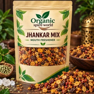May include: A tan stand-up pouch of Organic Spice World Jhankar Mix mouth freshener. The packaging features green leaf illustrations and clear text. The pouch contains a colorful blend of dried seeds, grains, and berries visible through a clear window.