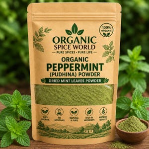 May include: A tan stand-up pouch containing organic peppermint powder. The label reads Organic Spice World, Organic Peppermint (Pudhina) Powder, and Dried Mint Leaves Powder. It features icons for 100% organic, no additives, and premium quality.