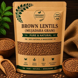 May include: A brown paper bag of brown lentils, labeled "BROWN LENTILS (MUJADARA GRAM)" with text indicating the product is pure, natural, and wholesome. The bag is surrounded by wooden bowls and a wooden scoop filled with lentils.