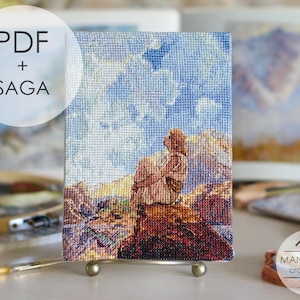 May include: A rectangular cross-stitch embroidery piece featuring a person sitting on a rock, looking up at a blue sky with clouds and mountains in the background. The text PDF + SAGA is visible in the upper left corner, and the MANSARDA cross stitch logo is in the lower right corner.