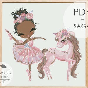 May include: A framed cross-stitch pattern featuring a ballerina and a unicorn, both in shades of pink and brown. The ballerina is wearing a pink tutu and has a floral headpiece. The unicorn has a floral mane and tail. The text "PDF + SAGA" is visible.