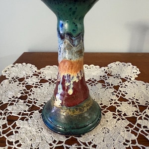 Studio pottery candlestick holder. Great combination of colors & super smooth glaze finish. This piece will compliment any room.