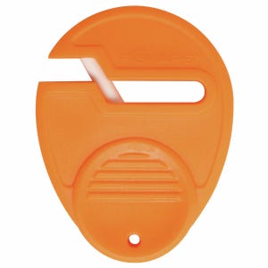 May include: An orange Fiskars paper cutter with a white blade. The cutter has a rounded shape with a slot for cutting and a small hole at the bottom. The Fiskars logo is visible on the surface.