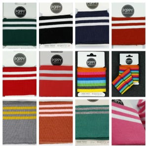 May include: A selection of fabric cuffs in various colours, each featuring white stripes. The cuffs include green, black, navy, red, orange, rainbow, grey, brown, teal, and pink. Each cuff has the word "POPPY" printed on the top.