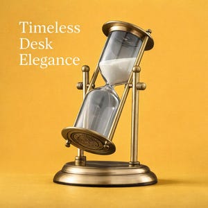 May include: An antique-style hourglass with a brass-colored frame and base, filled with white sand. The glass hourglass is tilted, with the sand flowing from the top to the bottom. The text "Timeless Desk Elegance" is in white.