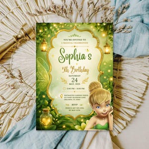 May include: A rectangular birthday invitation card featuring a green forest background with glowing fairy lights, a gold ornate frame, and an illustration of a blonde fairy. The text reads: You're invited to a magical celebration, Sophia's 5th Birthday.