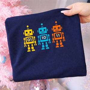 May include: A rustic wooden sign with the text "Welcome to our home" in white lettering. The sign features a distressed finish and a simple, inviting design, perfect for entryway decor.