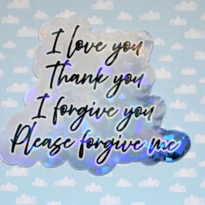 May include: A holographic sticker in the shape of a cloud, featuring the phrases "I love you," "Thank you," "I forgive you," and "Please forgive me" in black script. The background is light blue with white cloud patterns.