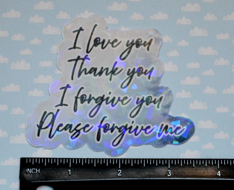 May include: Holographic sticker with the phrases "I love you, Thank you, I forgive you, Please forgive me" in black script. The sticker is cloud-shaped and measures approximately 4 inches in length.