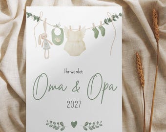 May include: A white rectangular card featuring a watercolor illustration of a clothesline with a plush rabbit, a green bib, a cream-colored romper, and green socks. The text reads "Ihr werdet Oma & Opa 2027" with green leaf accents and a heart.