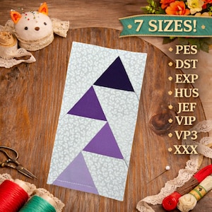 May include: A geometric quilt block with three purple triangles on a white floral background. The text "7 SIZES!" is above a list of embroidery file formats. Sewing notions, including thread spools, scissors, and a pin cushion, are arranged around the block.