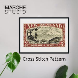 May include: Framed cross stitch pattern featuring a vintage New Zealand postage stamp design. The stamp is red and beige, with the text "New Zealand" and "Postage & Revenue." The image includes the text "Masche Studio" and "Cross Stitch Pattern."