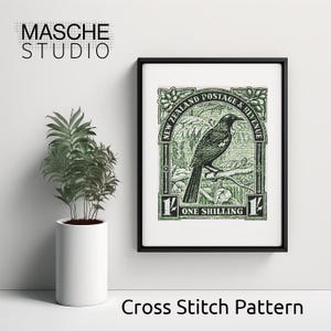 May include: Framed print featuring a green and black image of a bird on a branch, resembling a postage stamp. The text "NEW ZEALAND POSTAGE & REVENUE" and "ONE SHILLING" are visible. The frame is black, and the background is white.