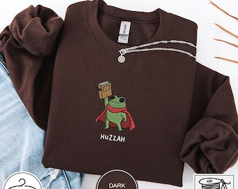 Sudadera bordada con rana lectora, sudadera de estilo cottagecore con arte popular, regalo original para amantes de los libros.