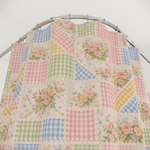 May include: A shower curtain featuring a patchwork design of alternating squares. The pattern includes pastel gingham checks in blue, pink, green, and yellow, interspersed with floral squares displaying pink roses and yellow flowers, all bordered by white lace trim.