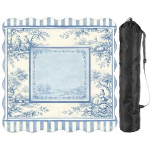 May include: A blue and white picnic blanket with a scalloped edge and a toile pattern depicting pastoral scenes. The blanket is rolled up in a black carrying bag with a shoulder strap, ideal for outdoor use.