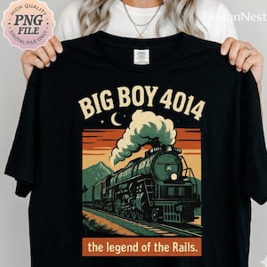 May include: Black t-shirt featuring a vintage illustration of a steam train with the text "BIG BOY 4014" and "the legend of the Rails." The design includes a crescent moon and mountain scenery.
