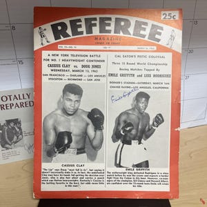 May include: Vintage March 1963 Referee Magazine cover featuring Cassius Clay and Doug Jones, and Emile Griffith and Luis Rodriguez. The cover has a red border and includes the magazine title and price.