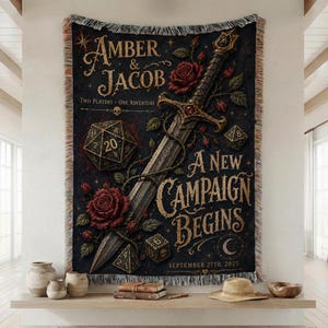 Puede incluir: Un tapiz tejido negro con una espada grande, rosas rojas y dados poliédricos. El texto dice: Amber & Jacob, Two Players One Adventure, A New Campaign Begins, September 27th, 2025. El diseño incluye una calavera, estrellas y una luna creciente.
