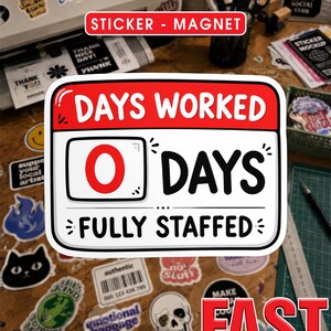 May include: A rectangular sticker with rounded corners featuring a red header that reads DAYS WORKED. Below, a white box displays a large red 0, followed by the text DAYS in black. The bottom section reads FULLY STAFFED in black text.