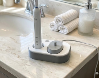 Organizzatore per spazzolini elettrici Oral-B: stazione di ricarica da appoggio con vassoio raccogligocce, inserto rimovibile e vano per riporre le testine.