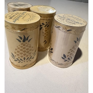 May include: A set of three ceramic mugs with a speckled, matte finish. The mugs are in shades of cream, light gray, and dark gray. Each mug has a simple, minimalist design and a rounded handle.