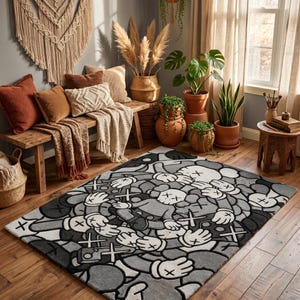 May include: A rectangular area rug featuring a repeating pattern of cartoon-style figures with X-shaped eyes and gloved hands. The design is rendered in a monochromatic palette of black, white, and various shades of gray, creating a dense, layered graphic.