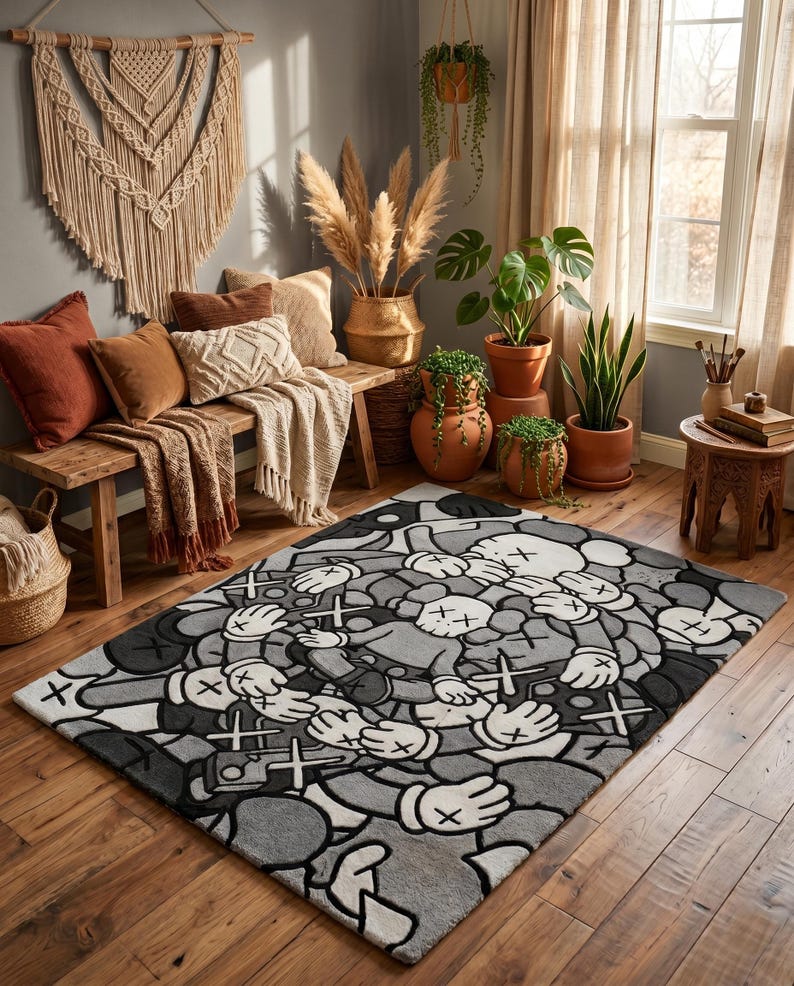 May include: A rectangular area rug featuring a repeating pattern of cartoon-style figures with X-shaped eyes and gloved hands. The design is rendered in a monochromatic palette of black, white, and various shades of gray, creating a dense, layered graphic.