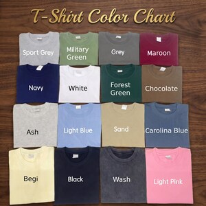 May include: A T-Shirt Color Chart displaying sixteen folded t-shirts in various colors including Sport Grey, Military Green, Grey, Maroon, Navy, White, Forest Green, Chocolate, Ash, Light Blue, Sand, Carolina Blue, Begi, Black, Wash, and Light Pink.