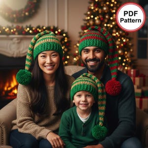 May include: A crochet PDF pattern for three long, pointed hats featuring horizontal stripes in green, red, and gold. Each hat includes a large, round pom-pom at the tip. The hats are designed with a ribbed brim and a long, dangling tail section.