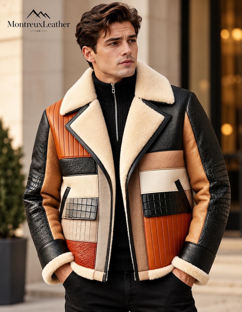 Puede incluir: Una chaqueta de cuero multicolor con cuello y pu&ntilde;os de piel de oveja color crema. La chaqueta presenta un dise&ntilde;o de patchwork con paneles negros, tostados, naranjas y beige, incluyendo secciones de cuero con relieve de cocodrilo y costuras verticales.