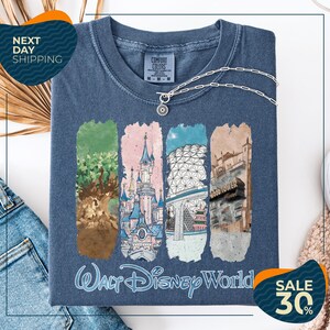 a blue t-shirt with a graphic design depicting various Disney World landmarks, including the Walt Disney World resort, the Wood Tower, and the Epcot Pavilion. The t-shirt is displayed on a white background, and there are two sale signs indicating a 30% discount on the item.
