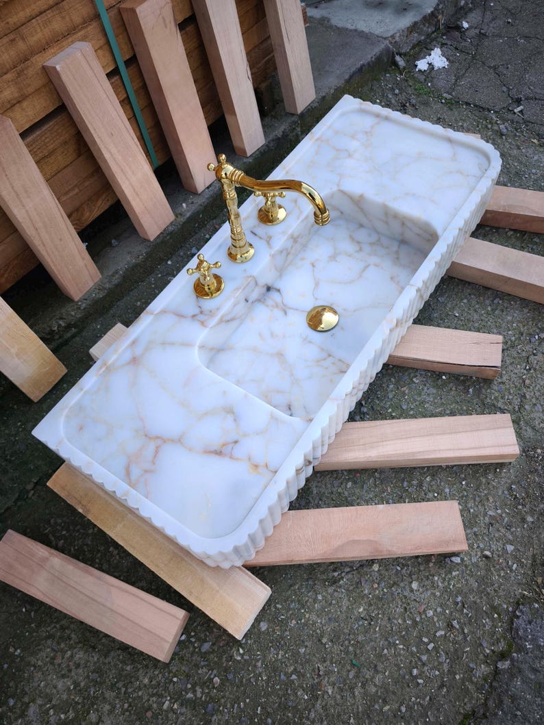 Elevate your space with a handcrafted marble sink from Turkey. Our collection includes calacatta marble sinks, carrera marble sinks, and stunning viola marble sinks, perfect for luxury bathrooms and kitchens. Explore the beauty of natural marble sinks today! Shop handmade marble sinks crafted from Turkish stone. Explore calacatta, carrara, and viola marble sinks for luxury bathrooms and kitchens. From moqui marble sinks to pergamon marble sinks. Handcrafted beauty and elegance in every detail.