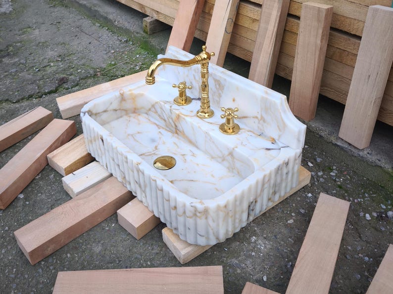 Bring antique charm to your home with our antique marble sinks and marble sink consoles. Each marble sink antique piece is a tribute to classic craftsmanship, blending history with the enduring beauty of stone marble sinks. Shop fluted marble sinks, ribbed marble sinks, marble vessel sinks. Handmade from the finest natural marbles for stunning home designs. Handcrafted marble sinks from Turkey. marble basin sinks, vanity sinks, and custom sink tops in beautiful natural stones like viola marble.