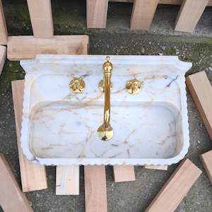 Discover the timeless appeal of a marble sink bowl or marble basin sink crafted with precision. From fluted marble sinks to ribbed marble sinks, each piece tells a story of craftsmanship and Turkish heritage. Customize your dream sink today! Elevate your bathroom with a custom marble sink. Choose from calacatta gold, lilac marble, and antique marble sink options, handcrafted in Turkey. Discover handcrafted marble sinks. Calcutta, viola, travertine, and arabescato marble sinks available.