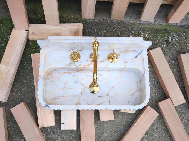 Discover the timeless appeal of a marble sink bowl or marble basin sink crafted with precision. From fluted marble sinks to ribbed marble sinks, each piece tells a story of craftsmanship and Turkish heritage. Customize your dream sink today! Elevate your bathroom with a custom marble sink. Choose from calacatta gold, lilac marble, and antique marble sink options, handcrafted in Turkey. Discover handcrafted marble sinks. Calcutta, viola, travertine, and arabescato marble sinks available.