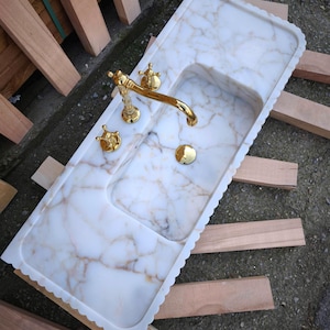 Upgrade your vanity with a marble sink top or a marble vanity sink in gorgeous carrara marble or calacatta monet marble. Our sinks combine elegance with functionality, offering both wall mounted and pedestal sink options for every design. Luxury marble sinks made from aegean marble, carrara, and calcutta marble. Wall-mounted, pedestal, and floating styles available. Shop handmade marble sinks crafted from Turkish stone. Explore calacatta, carrara, viola marble sinks for bathrooms and kitchens.