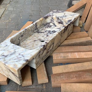 Upgrade your vanity with a marble sink top or a marble vanity sink in gorgeous carrara marble or calacatta monet marble. Our sinks combine elegance with functionality, offering both wall mounted and pedestal sink options for every design. Luxury marble sinks made from aegean marble, carrara, and calcutta marble. Wall-mounted, pedestal, and floating styles available. Shop handmade marble sinks crafted from Turkish stone. Explore calacatta, carrara, viola marble sinks for bathrooms and kitchens.