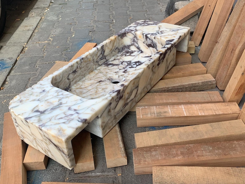 Upgrade your vanity with a marble sink top or a marble vanity sink in gorgeous carrara marble or calacatta monet marble. Our sinks combine elegance with functionality, offering both wall mounted and pedestal sink options for every design. Luxury marble sinks made from aegean marble, carrara, and calcutta marble. Wall-mounted, pedestal, and floating styles available. Shop handmade marble sinks crafted from Turkish stone. Explore calacatta, carrara, viola marble sinks for bathrooms and kitchens.