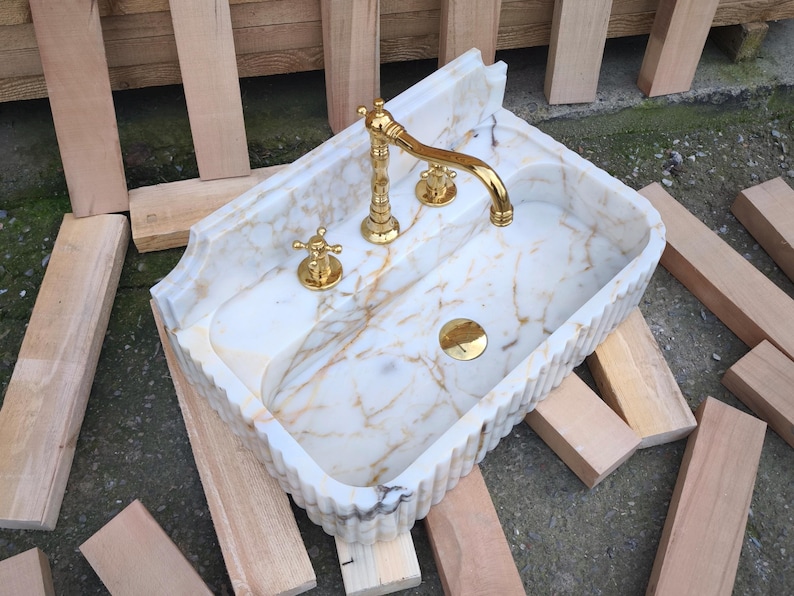 Elevate your space with a handcrafted marble sink from Turkey. Our collection includes calacatta marble sinks, carrera marble sinks, and stunning viola marble sinks, perfect for luxury bathrooms and kitchens. Explore the beauty of natural marble sinks today! Shop handmade marble sinks crafted from Turkish stone. Explore calacatta, carrara, and viola marble sinks for luxury bathrooms and kitchens. From moqui marble sinks to pergamon marble sinks. Handcrafted beauty and elegance in every detail.