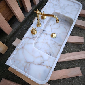Searching for a custom marble sink? We offer integrated marble sinks and marble floating sinks made to order! Choose from lilac marble sinks, travertine marble sinks, and more to complete your perfect luxury bathroom renovation.
Handcrafted marble sinks from Turkey. Find marble basin sinks, vanity sinks, and custom sink tops in beautiful natural stones like viola marble.
Elevate your bathroom with a custom marble sink. From calacatta gold, antique marble sink options, handcrafted in Turkey.