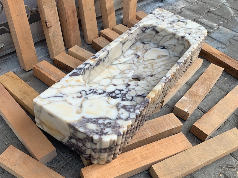 Searching for a custom marble sink? We offer integrated marble sinks and marble floating sinks made to order! Choose from lilac marble sinks, travertine marble sinks, and more to complete your perfect luxury bathroom renovation.
Handcrafted marble sinks from Turkey. Find marble basin sinks, vanity sinks, and custom sink tops in beautiful natural stones like viola marble.
Elevate your bathroom with a custom marble sink. From calacatta gold, antique marble sink options, handcrafted in Turkey.