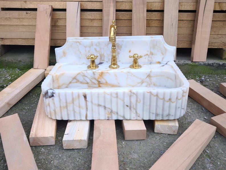 Find your perfect bathroom marble sink with our extensive range of vessel sinks, wallmount sinks, and trough sinks. Featuring luxury stones like viola marble and calcutta marble, our sinks create breathtaking focal points. Elegant marble kitchen sinks, utility sinks, and workstation sinks available in custom designs. Turkish marble craftsmanship at its best. Transform your space with a marble wall sink or marble countertop sink. Featuring calacatta marble, travertine, and italian marble sinks.